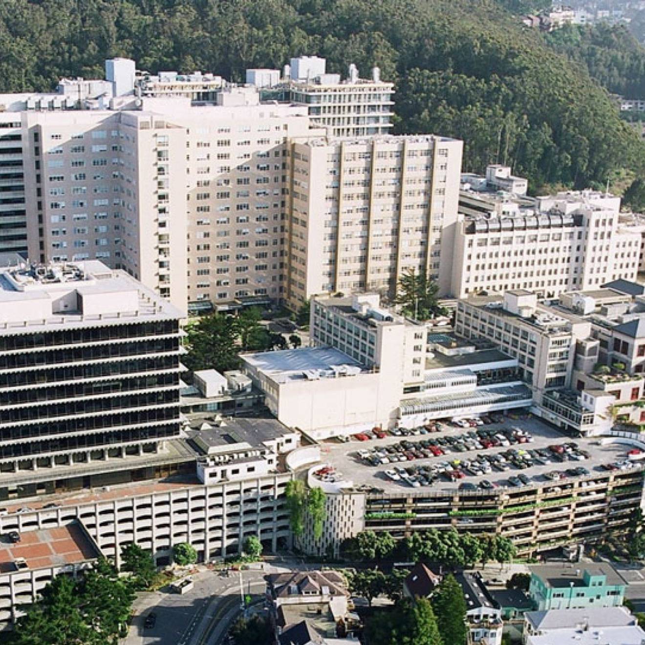 UCSF campus Aerial view of the UCSF Parnassus campus, white buildings at the base of a hill with trees