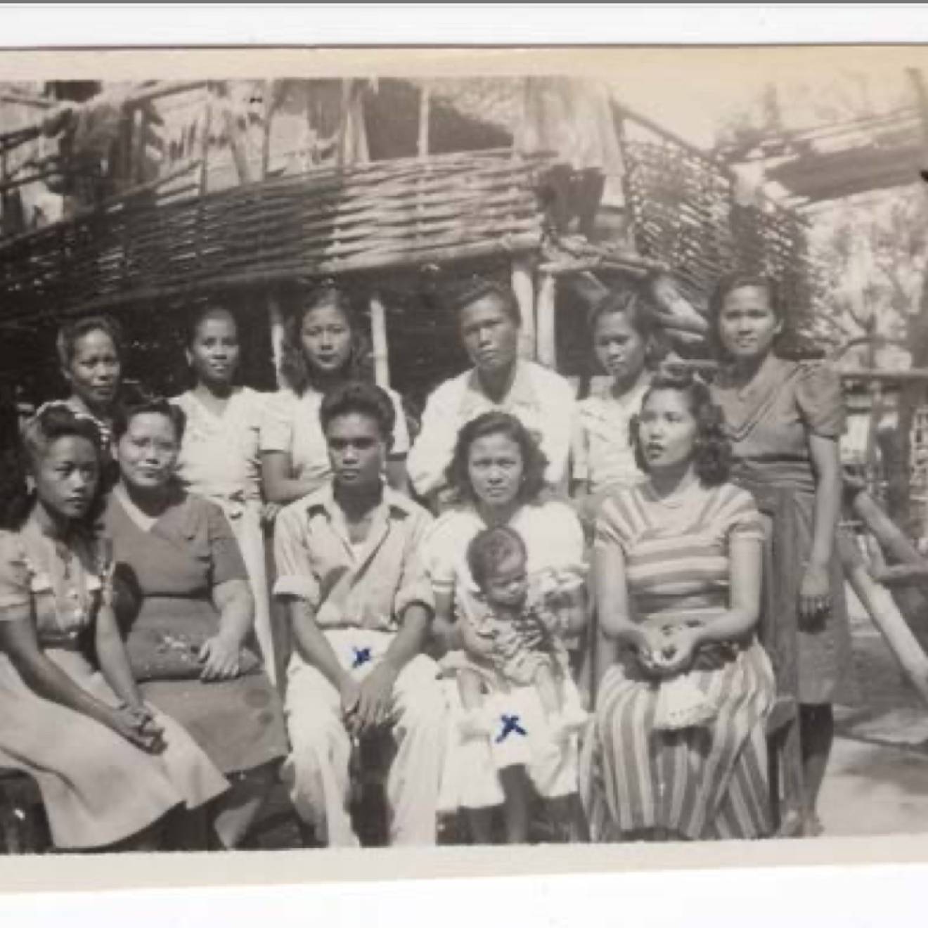 Preserving Filipino stories In an old black-and-white photo, a family poses outside