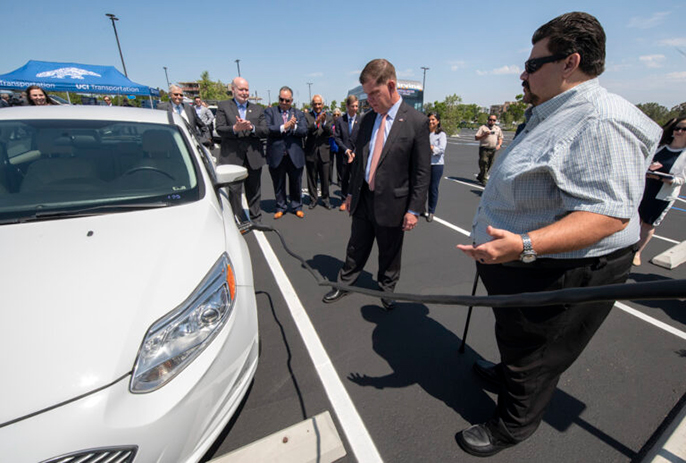 Secretary of Labor Marty Walsh with an electric car